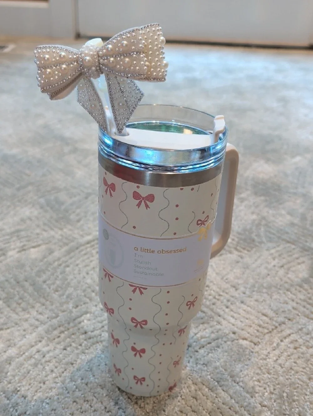 White Patterned Travel Mug with Handle and Decorative Bow
